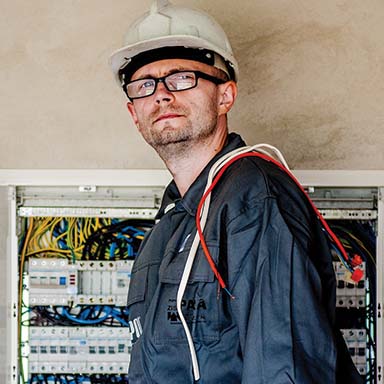 Construction Trades - Electrician working on building